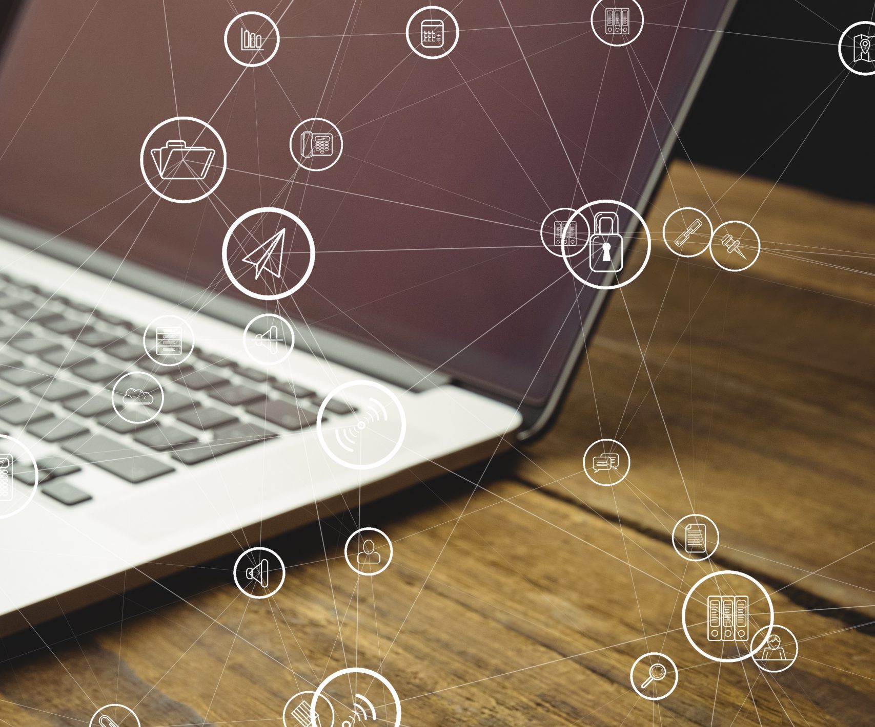 digital composite of laptop with communication graphics